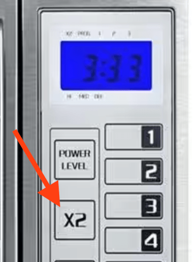 microwave panel pointing to a button that says x2